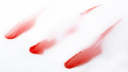 Red lip gross brush stroke on white background