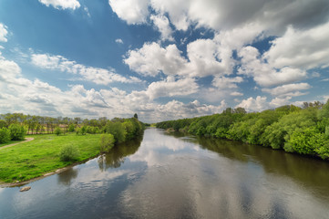 Fototapeta premium landscape with river and sky with clouds