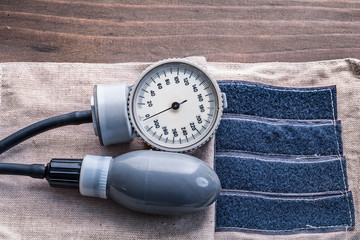 blood pressure monitor on wooden boards close up