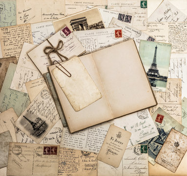 Open book, old letters and postcards. Travel scrapbook France Pa