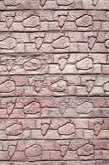 Red decorative relief plaster imitating stones