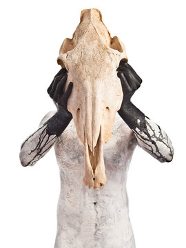 prehistoric man with horse skull
