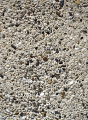 Plaster with  pebbles on wall closeup
