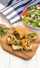 Swiss Chard Rolls on Chopping Board with Lettuce Rocket Radishes