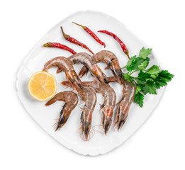 Fresh shrimps on plate with pepper.