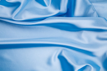 Blue silk cloth texture closeup.