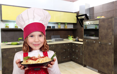 little girl cook eat spaghetti in kitchen