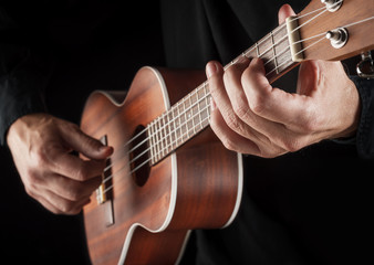 Fototapeta na wymiar playing hawaiian ukulele
