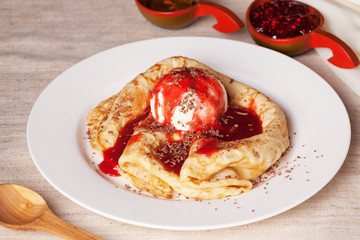 pancake with ice cream drizzled syrup and chocolate chips red