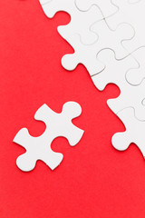 Jigsaw puzzle over the red background