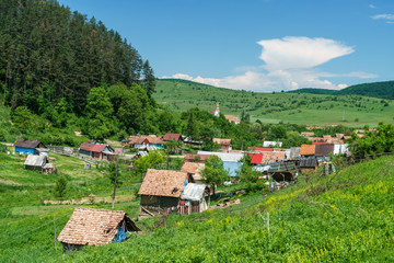 small village between the hills - obrazy, fototapety, plakaty