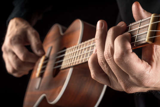 hands playing ukulele