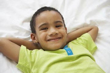 Young Boys Relaxing On Bed