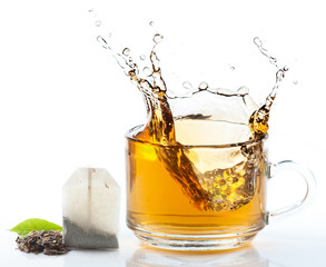 glass cup of tea withsplash out