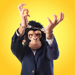 Naklejka premium Monkey man with handcuffs