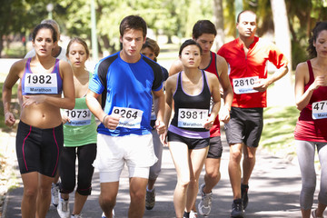 Group Of Marathon Runners At Start Of Race