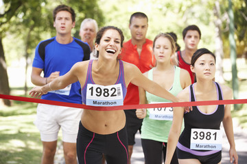 Female Athlete Winning Marathon Race
