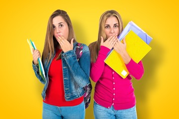 Student women doing surprise gesture over white background