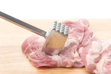 Meat Tenderizer on wooden board. isolated on white background