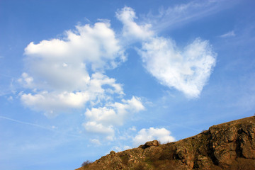 Heart from cloud on blue sky background