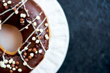Glazed Doughnuts with chocolate and icing on white Plate