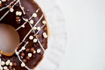 Glazed Doughnuts with chocolate and icing on white Plate