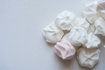 French vanilla meringue cookies on white background close up