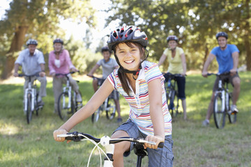 Fototapeta na wymiar Three Generation Family On Cycle Ride In Countryside