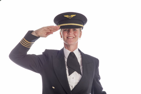 Senior airline pilot in uniform saluting