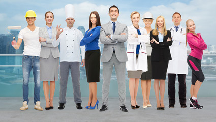 happy businessman over professional workers