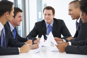 Group Of Businessmen Having Meeting In Office