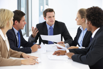 Group Of Business People Having Meeting In Office