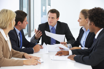 Group Of Business People Having Meeting In Office