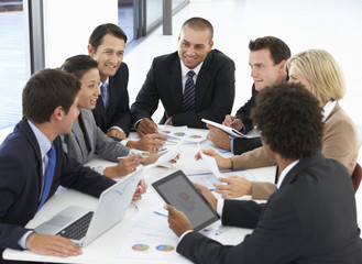 Group Of Business People Having Meeting In Office