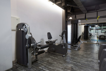 Fototapeta na wymiar Exercising equipment in gym