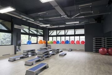 Step boards and pilates balls in gym
