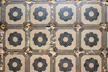 Old tile texture with simple floral elements. Texture.