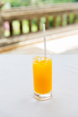 glass of fresh orange fruit juice at restaurant