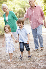 Grandparents On Country Walk With Grandchildren