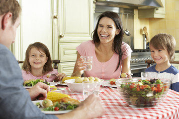 Obraz na płótnie Canvas Family Eating Meal Together In Kitchen