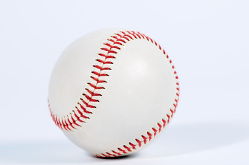 Single baseball with red knit.