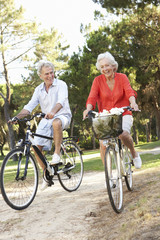 Senior Couple Enjoying Cycle Ride