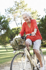 Senior Woman Enjoying Cycle Ride