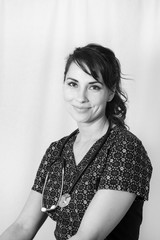 Beautiful hispanic nurse in scrubs