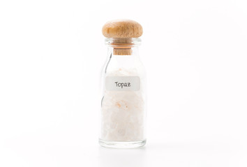 topaz in glass bottle isolated