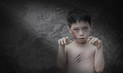Fototapeta premium Young Asian boy in zombie make up for Halloween