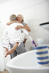 Romantic Senior Couple In Bathroom