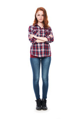 Full-length portrait of a beautiful young red-haired girl lookin