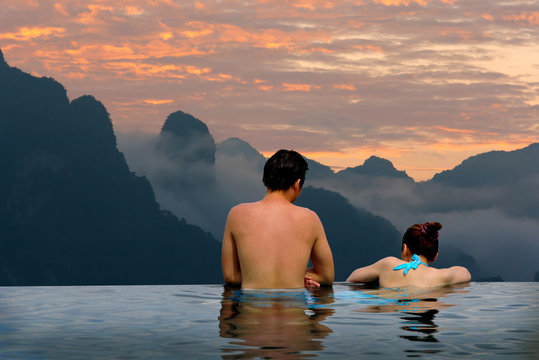 Man and Woman relaxing in Swimming pool