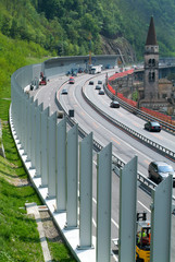 Workers during the installation of noise barriers on the highway